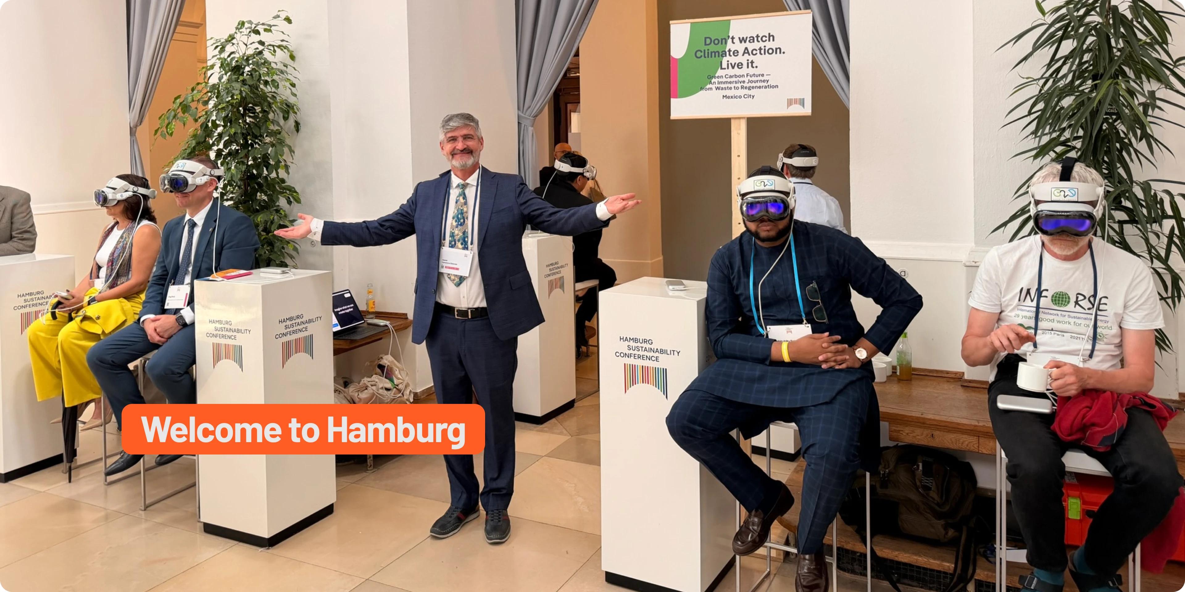Delegates at the Hamburg Sustainability Conference wearing Apple Vision Pro headsets